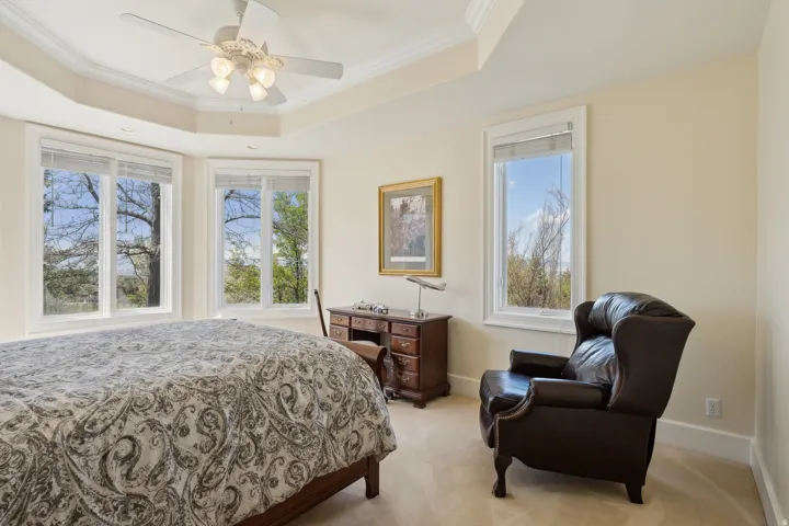 Recessed tray ceiling with crown molding and ceiling fan