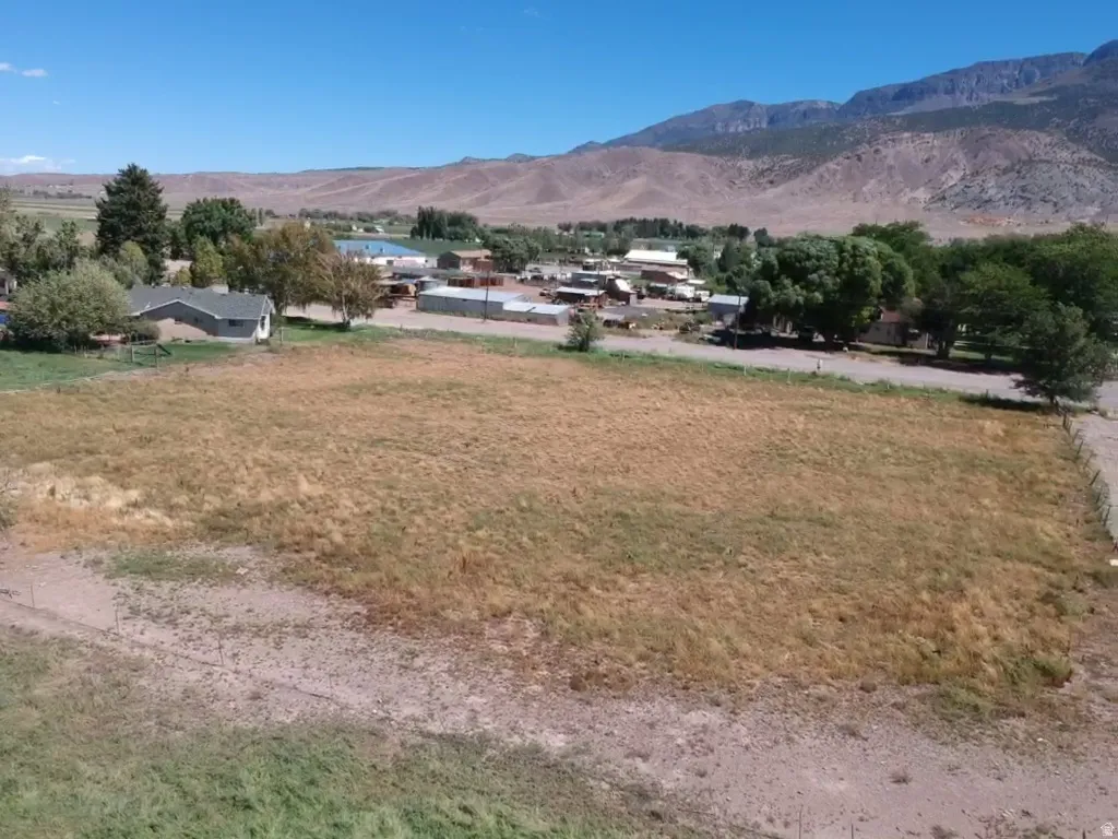Expansive lot featuring a natural landscape and surrounding mountain range
