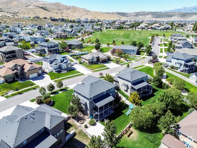 Expansive community with manicured green spaces and paved streets