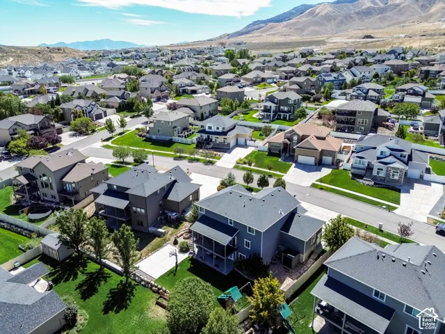 Residential neighborhood with varied architectural styles and mountain backdrop