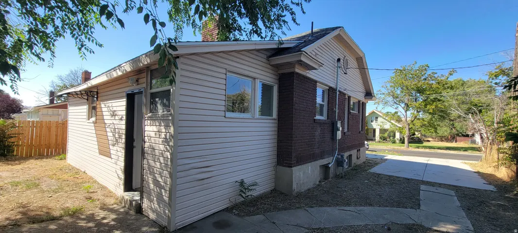 Exterior featuring brick and siding finishes