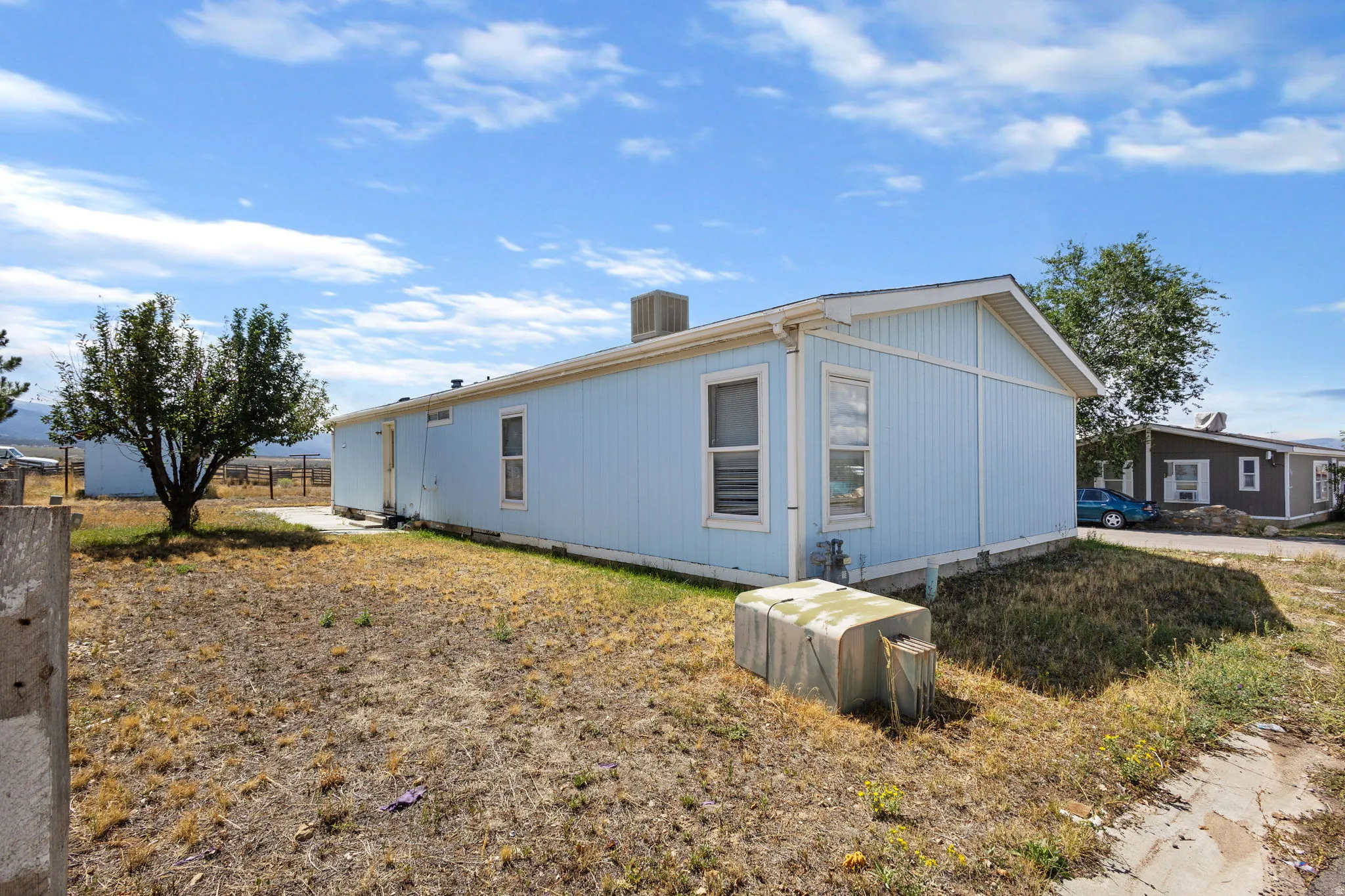 Light blue siding exterior with white trim