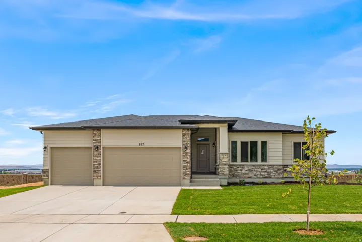 Contemporary exterior with light-toned siding and stone accents