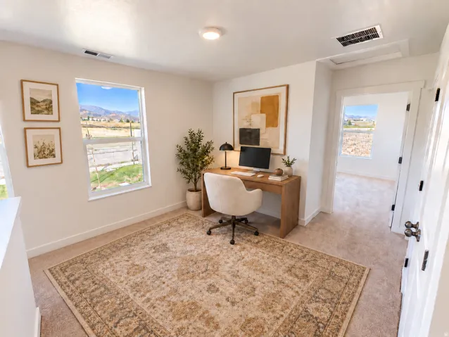 Bright interior with light-toned walls and plush carpeting