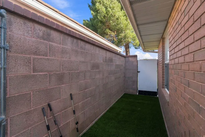 Brick exterior wall with a horizontal window and an attached soffit