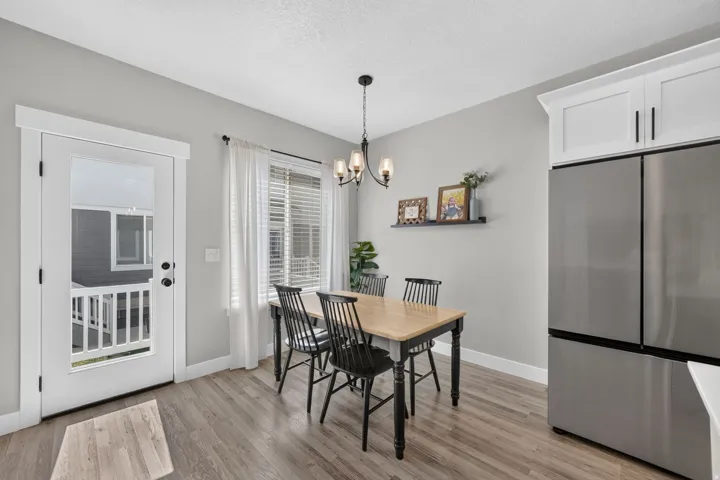 Wood-finish flooring with light gray walls and white trim