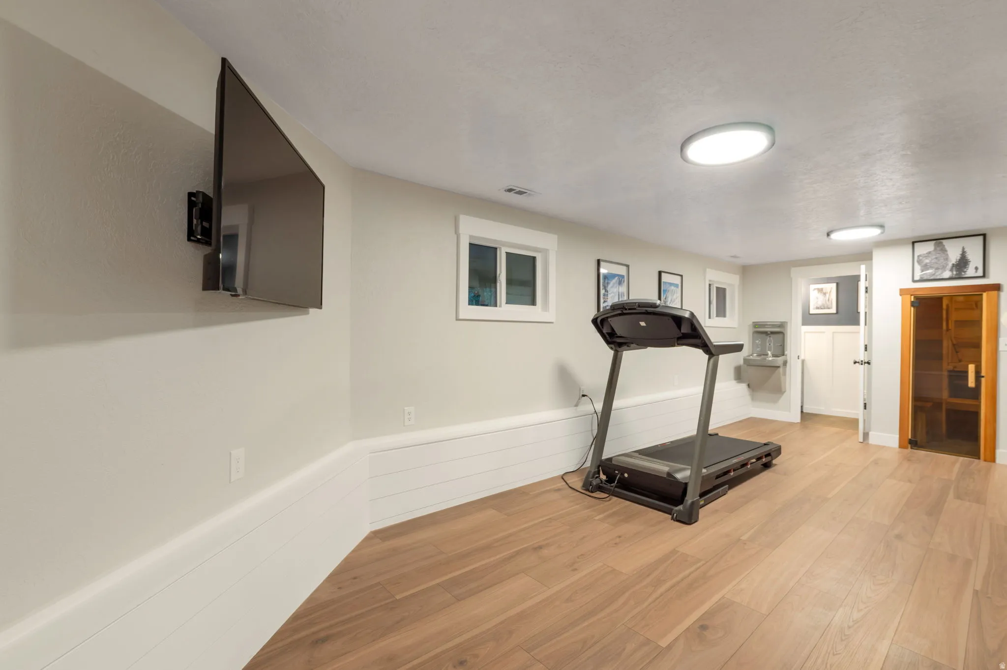 Use it as a bedroom or exercise room. This space has its own bathroom, cedar wood sauna, drinking fountain and built in cabinets with tons of storage space.