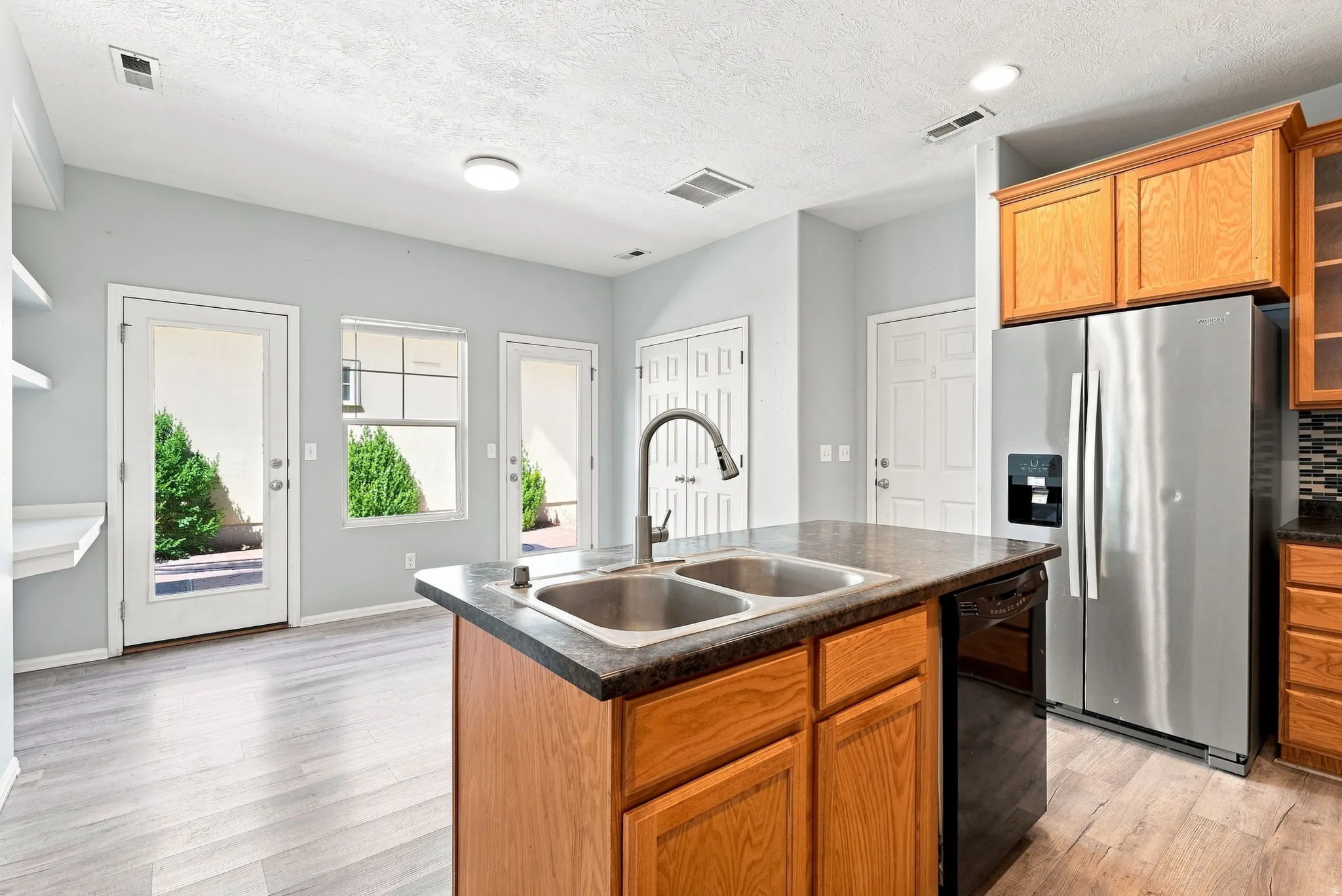 Kitchen island with double basin sink and gooseneck faucet