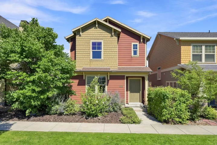 Two-story residence featuring composite siding and shingle accents