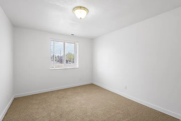 Neutral wall finishes and carpeted flooring