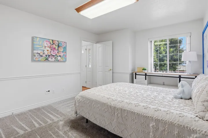 Recessed window with a built-in wood-finish desk featuring sliding barn door details