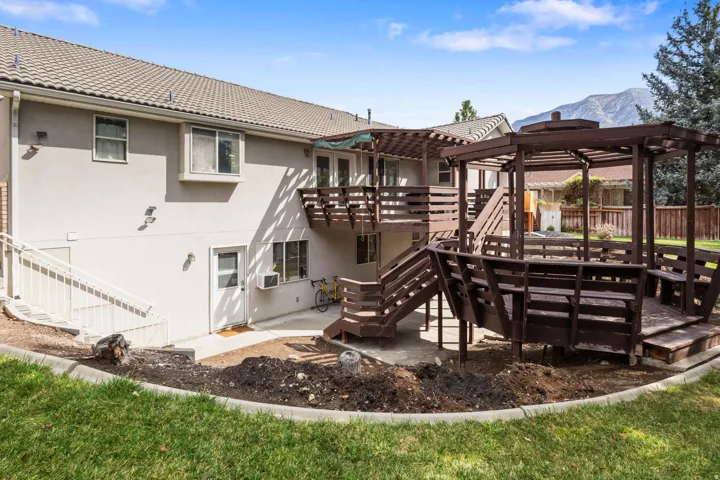 Multi-level deck with a built-in pergola and integrated seating