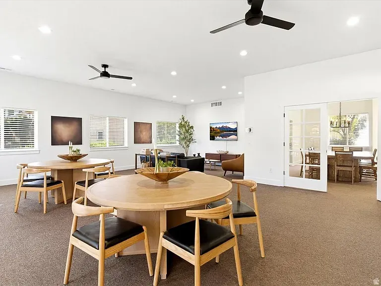 Recessed lighting, white walls, and ceiling fans