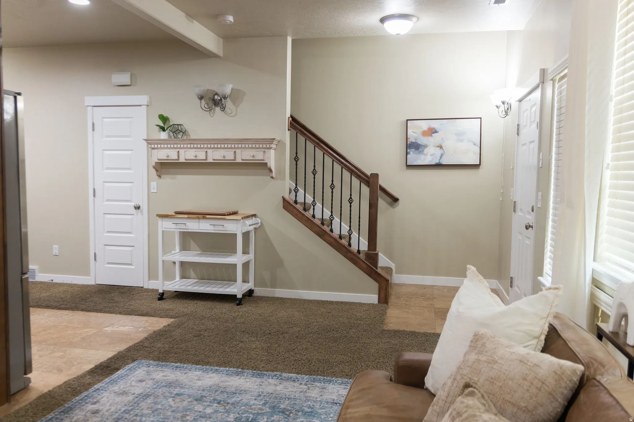 Wood-finish staircase with wrought iron balusters