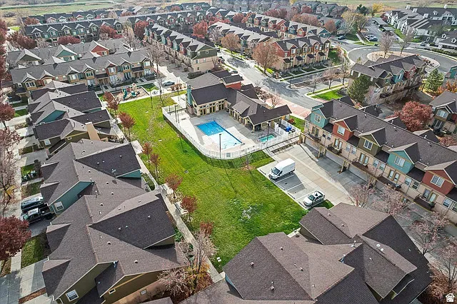 Community amenities featuring a swimming pool, clubhouse, and green spaces