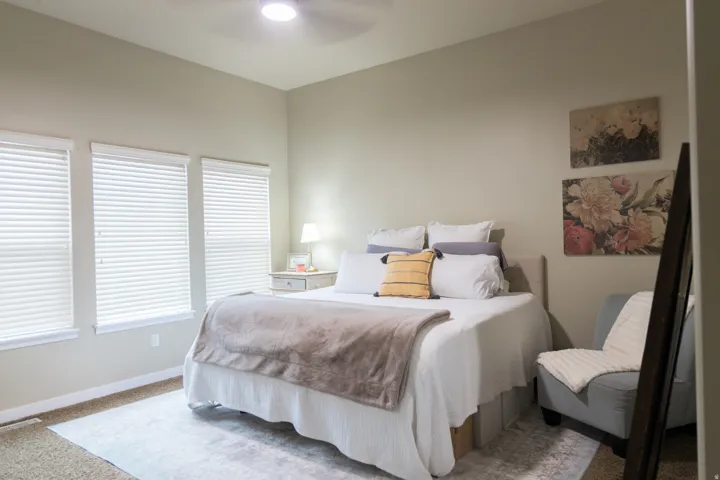 Recessed lighting, ceiling fan, and multiple windows with blinds