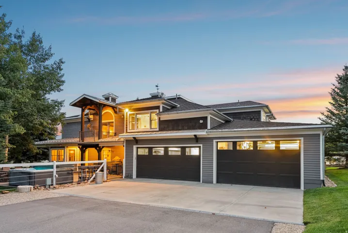 Multi-story exterior with dark gray siding and shake accents