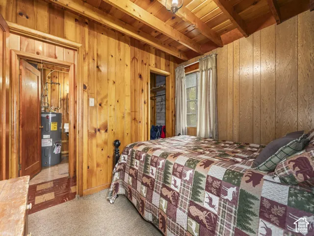 Wood-paneled walls with exposed ceiling beams