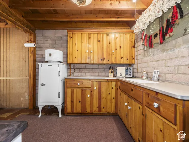 Wood-finish ceiling beams with exposed wood-finish planking