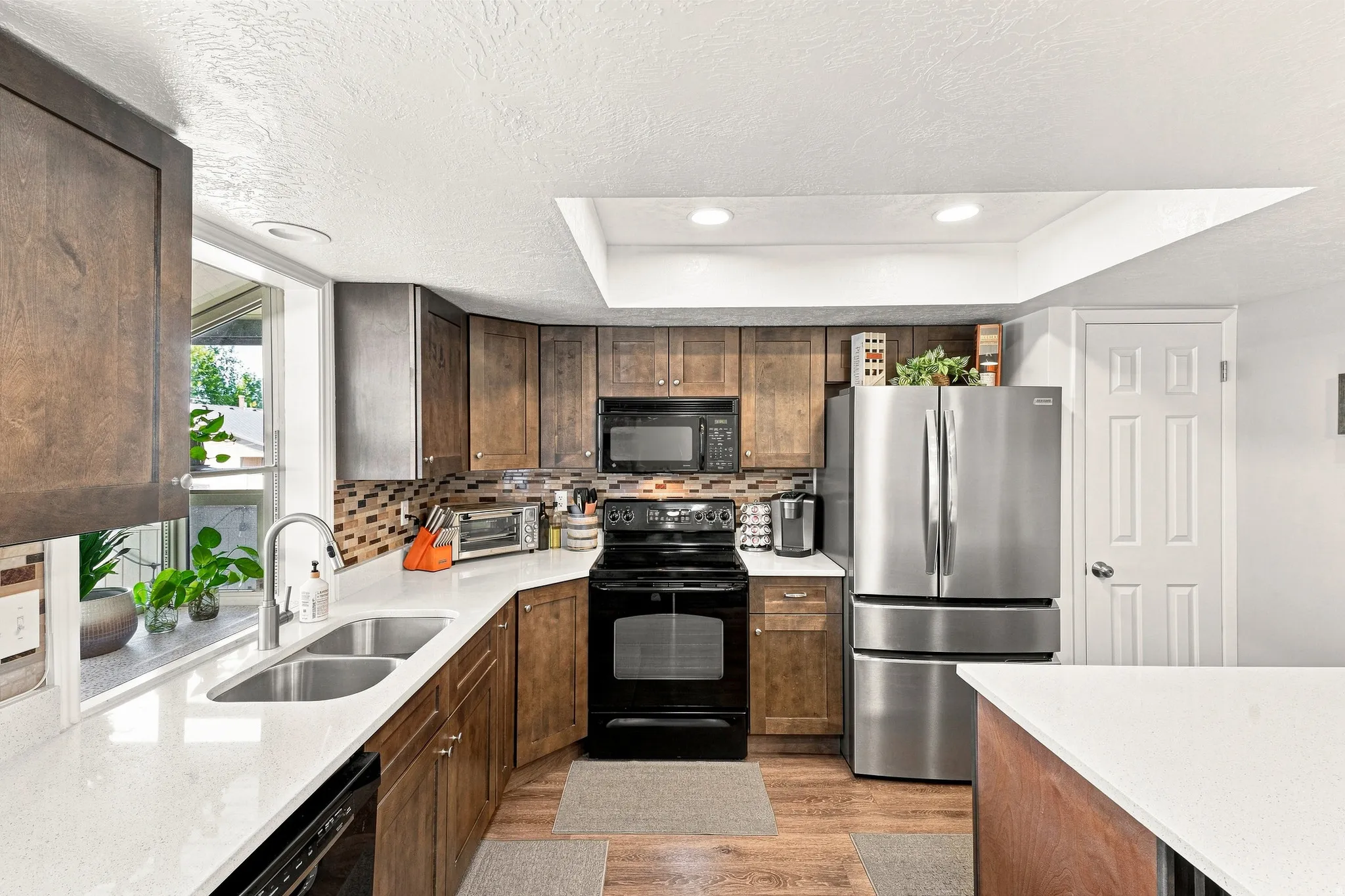NEW Cabinetry, Quartz Countertops, Appliances, Can Lighting. Nice Pantry