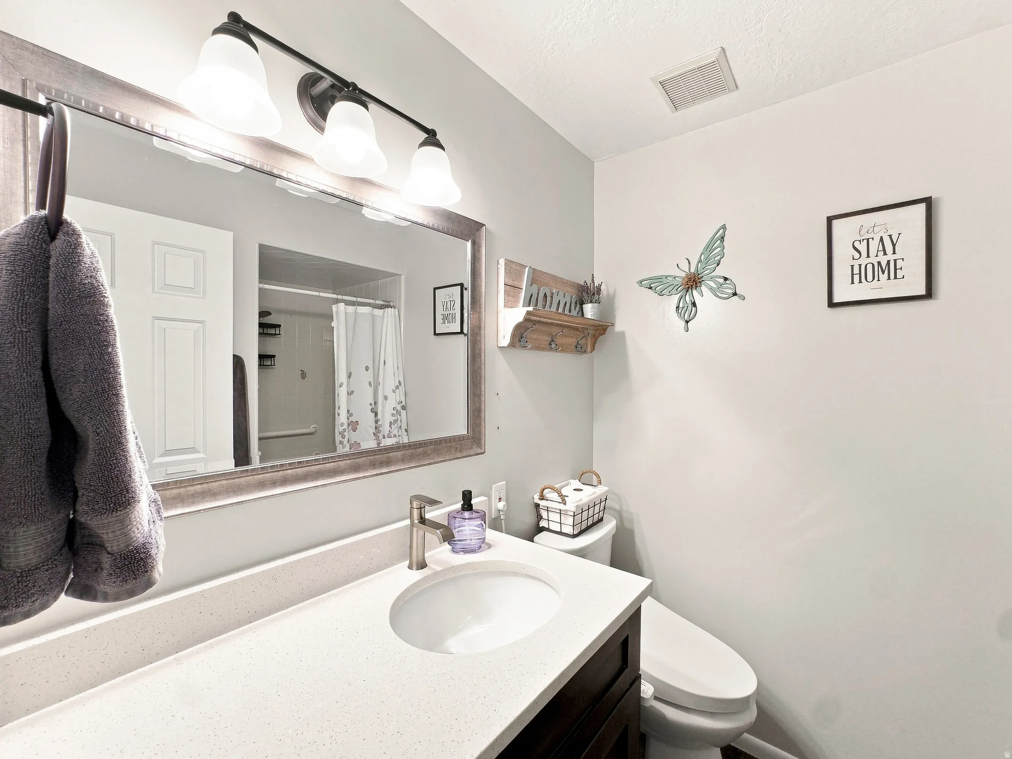 New Cabinets, Quarts, Mirror, New Lights, Toilet and Plumbing Fixtures, Added Electrical Outlet