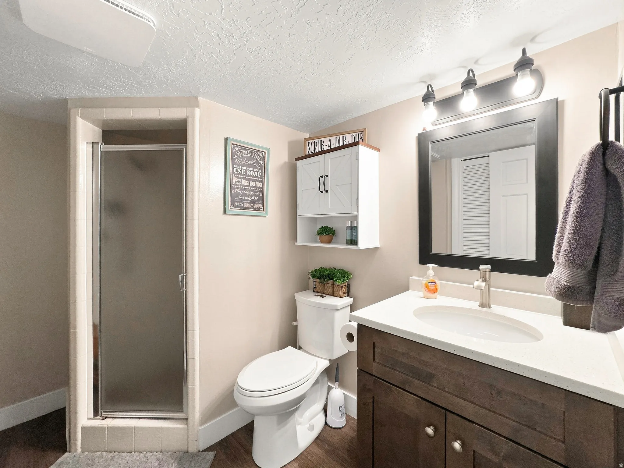 Basement 3/4 Bathroom with New Cabinets, Quarts, New Lights, Toilet and Plumbing Fixtures