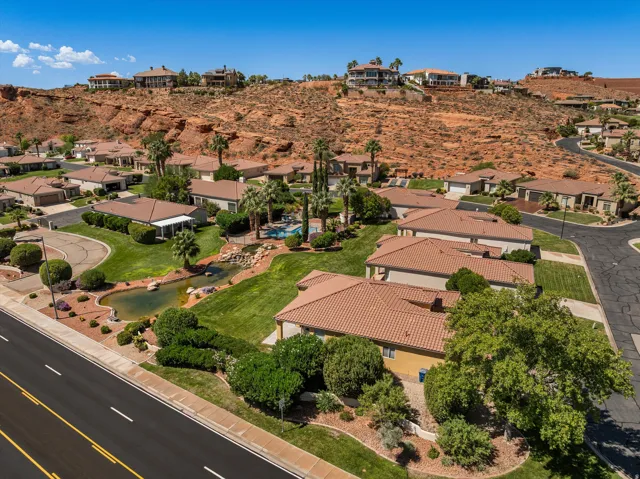 Community amenities featuring a swimming pool, rock water feature, and a pond