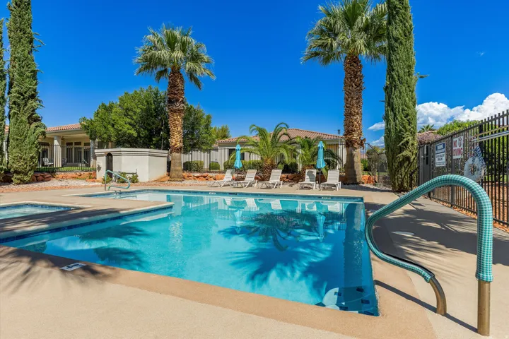 Swimming pool with integrated spa and surrounding deck