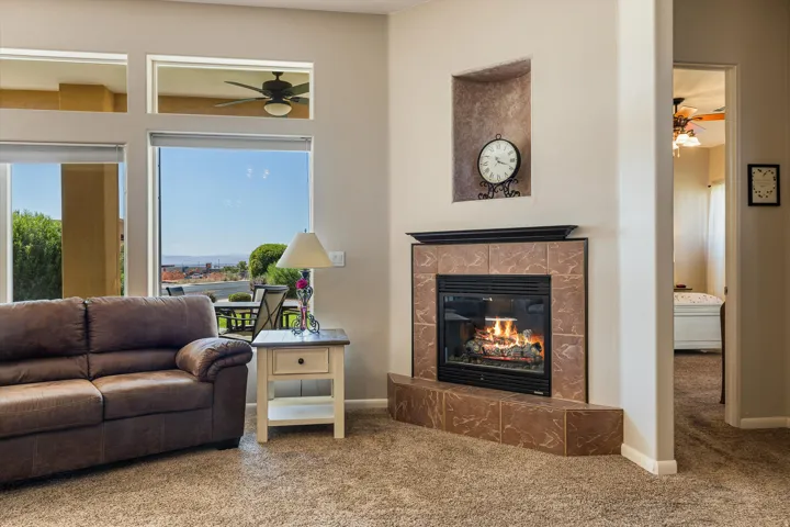 Corner fireplace with tile surround and mantel