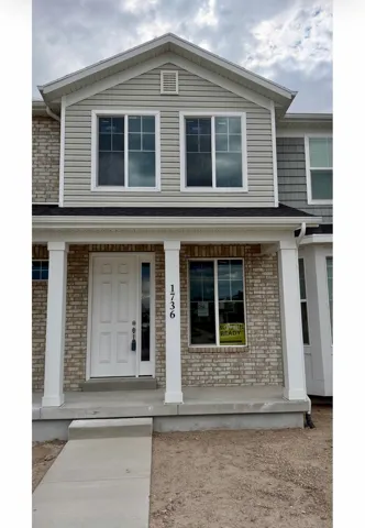 Two-story exterior with brick and horizontal siding