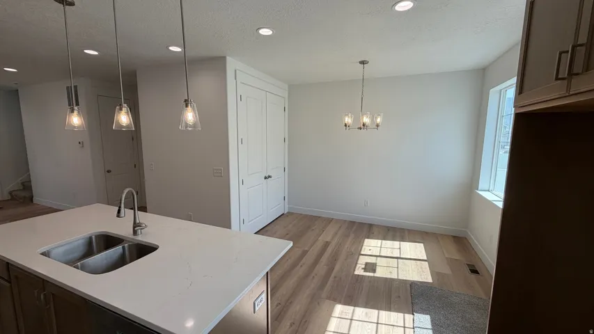 Kitchen island with a double basin sink and a single-handle faucet