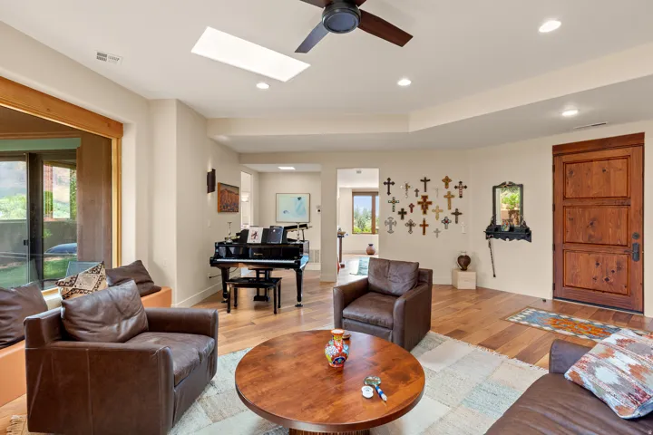 Recessed lighting and a skylight illuminate the space