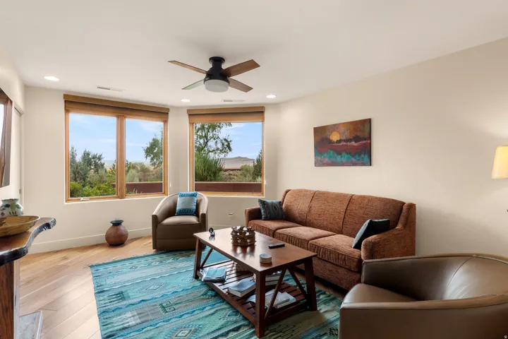 Wood-finish flooring, recessed lighting, and a ceiling fan