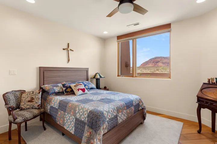 Recessed lighting, wood-finish flooring, and a ceiling fan