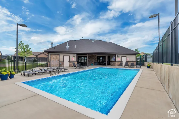 Rectangular swimming pool with concrete decking