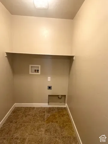 Integrated overhead lighting, built-in shelving, and tiled flooring