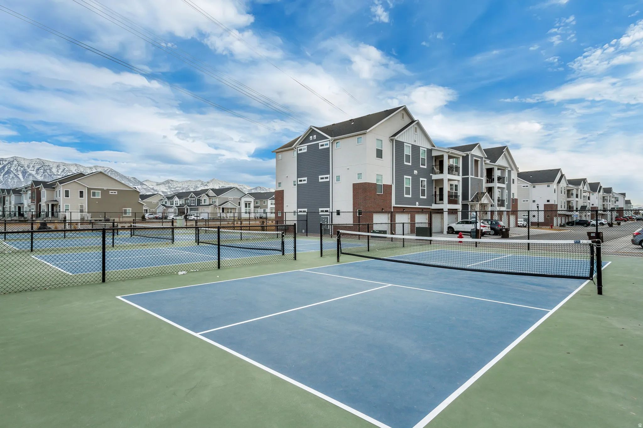 Multiple outdoor sports courts with durable surfacing