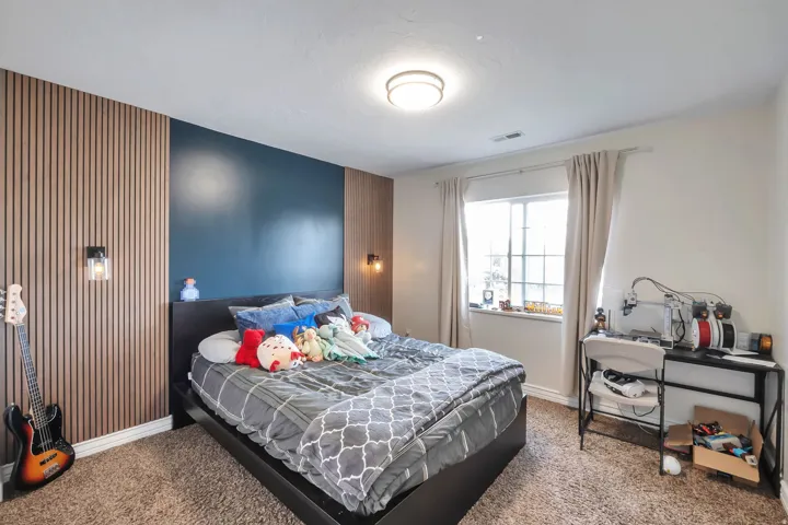 Feature wall with vertical wood paneling and a contrasting painted accent