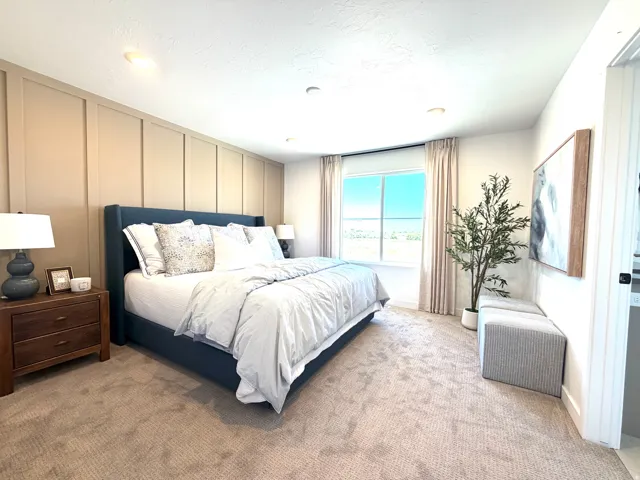 Recessed lighting illuminates the room, featuring a board and batten accent wall
