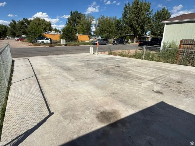 Paved concrete surface with chain-link fencing
