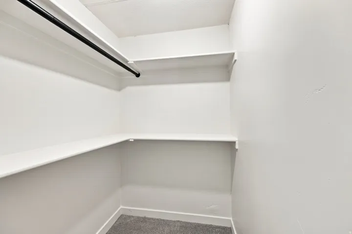 Wrap-around shelving with a full-width hanging rod