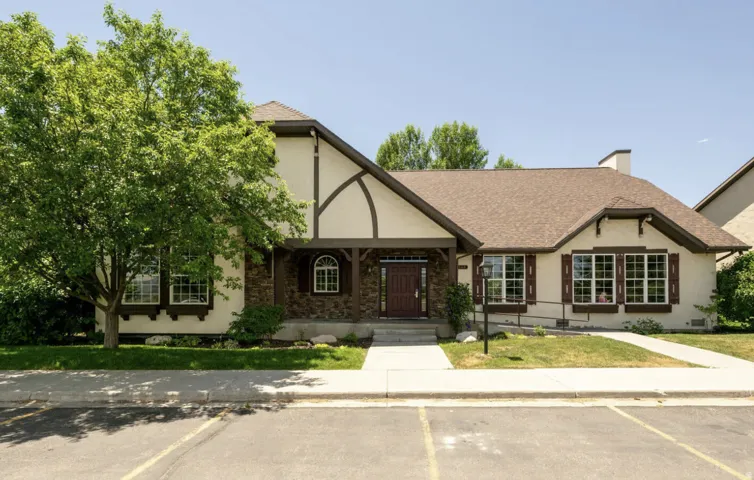 Tudor-style exterior with stone facade accents and decorative timber framing