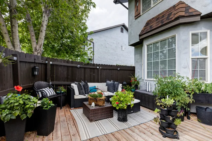 Wood-finish decking with a dark-stained privacy fence