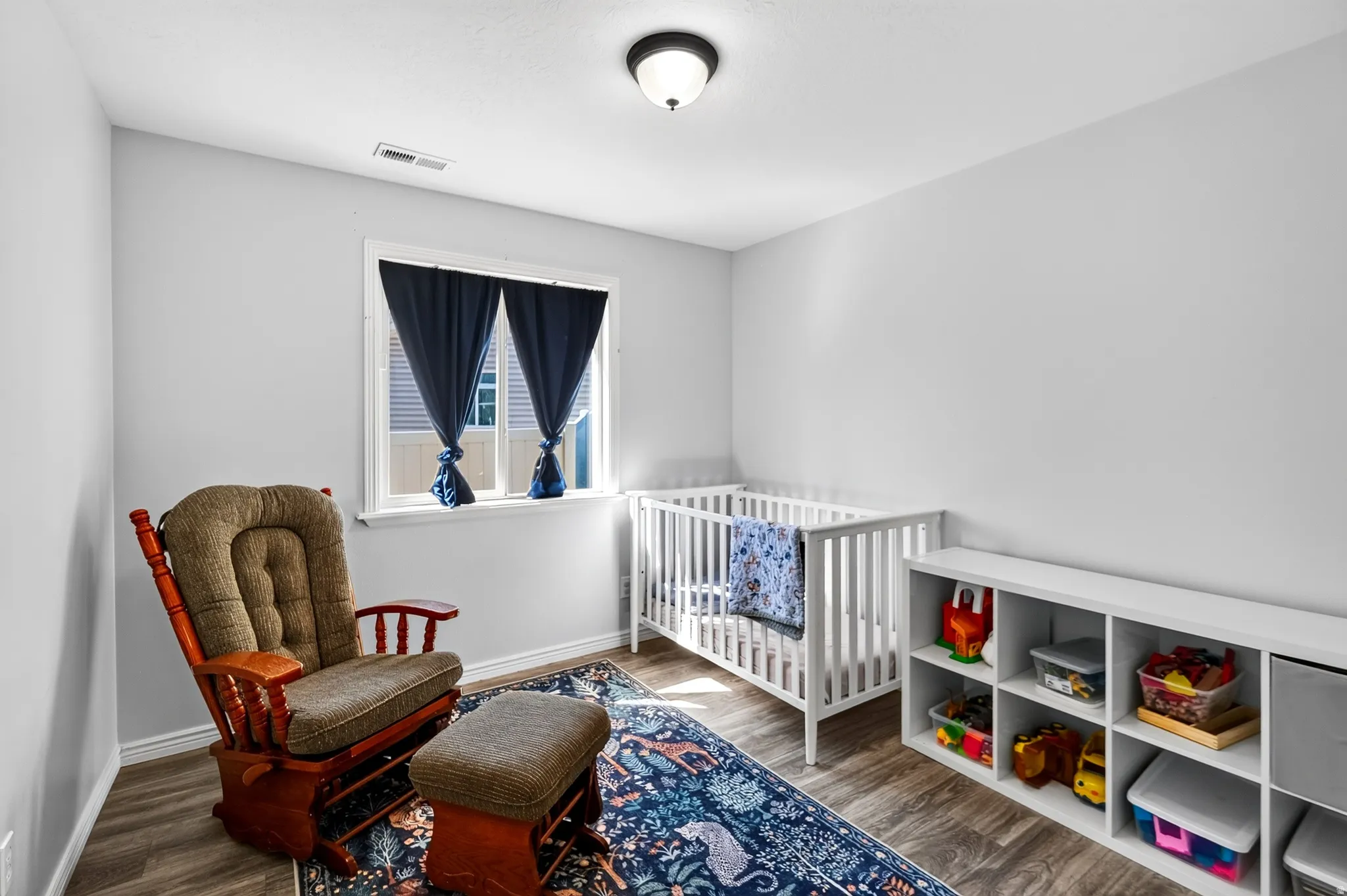 White walls with wood-finish flooring