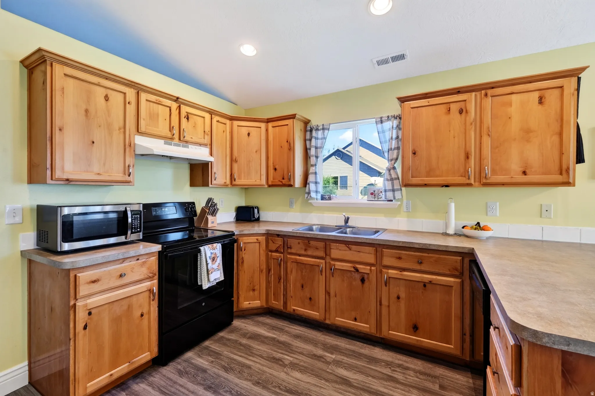 Wood-finish cabinetry paired with light-toned countertops