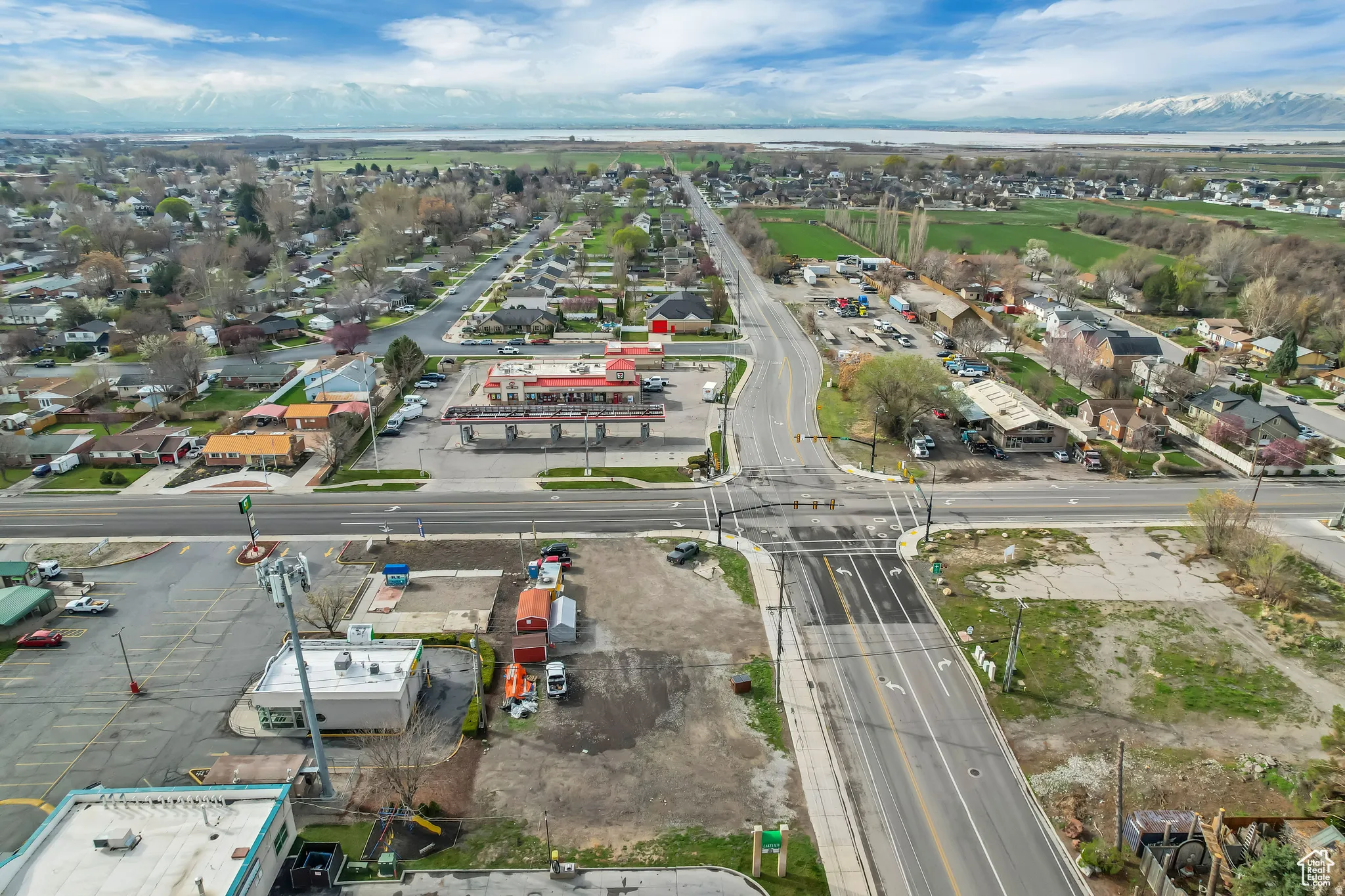 Aerial perspective of a developed area with a road network, surrounded by established residential structures