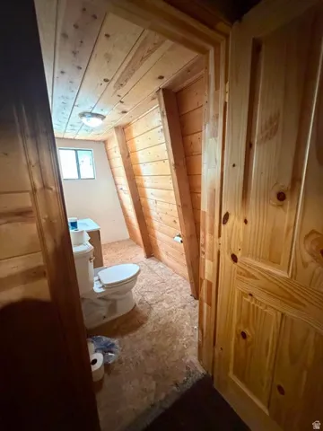 Wood plank ceiling with a flush-mount light fixture