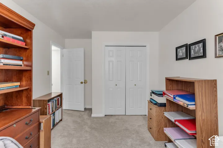 Neutral wall color, carpet flooring, interior doors, and bi-fold closet doors