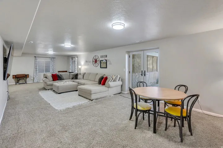 Spacious room with light neutral carpet and recessed lighting