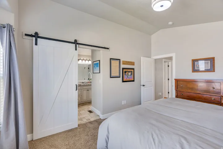 Interior room with vaulted ceilings and light beige walls
